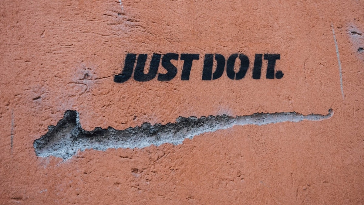 Nike Just Do It, on a wall, slogan, art, street art.